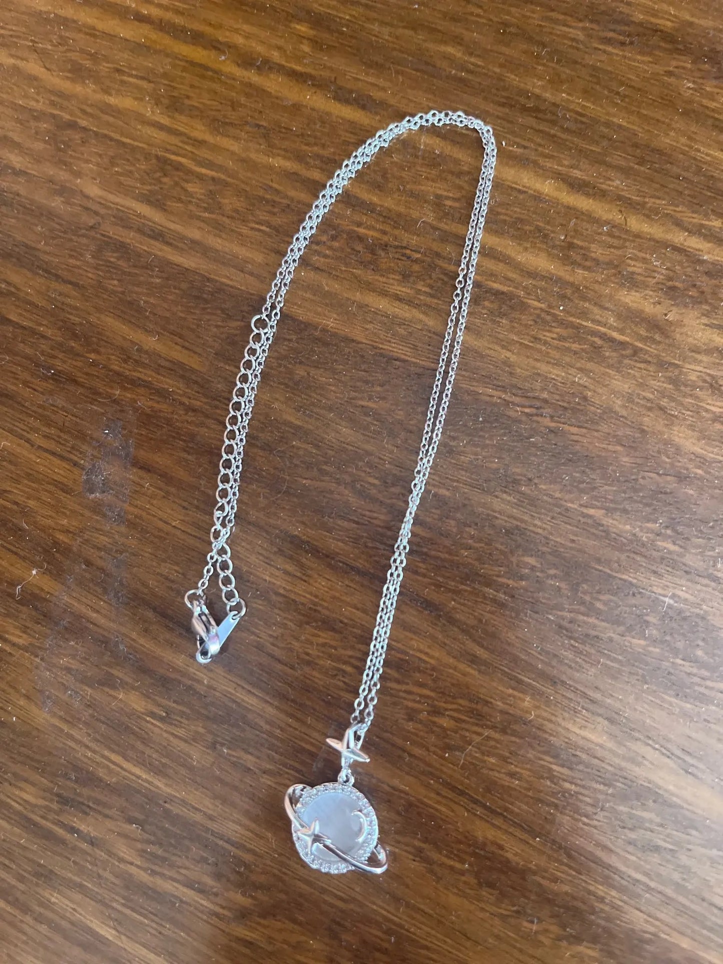 COLLAR SATURNO ESTRELLADO ELEGANTE CRISTAL DE CIRCONIA