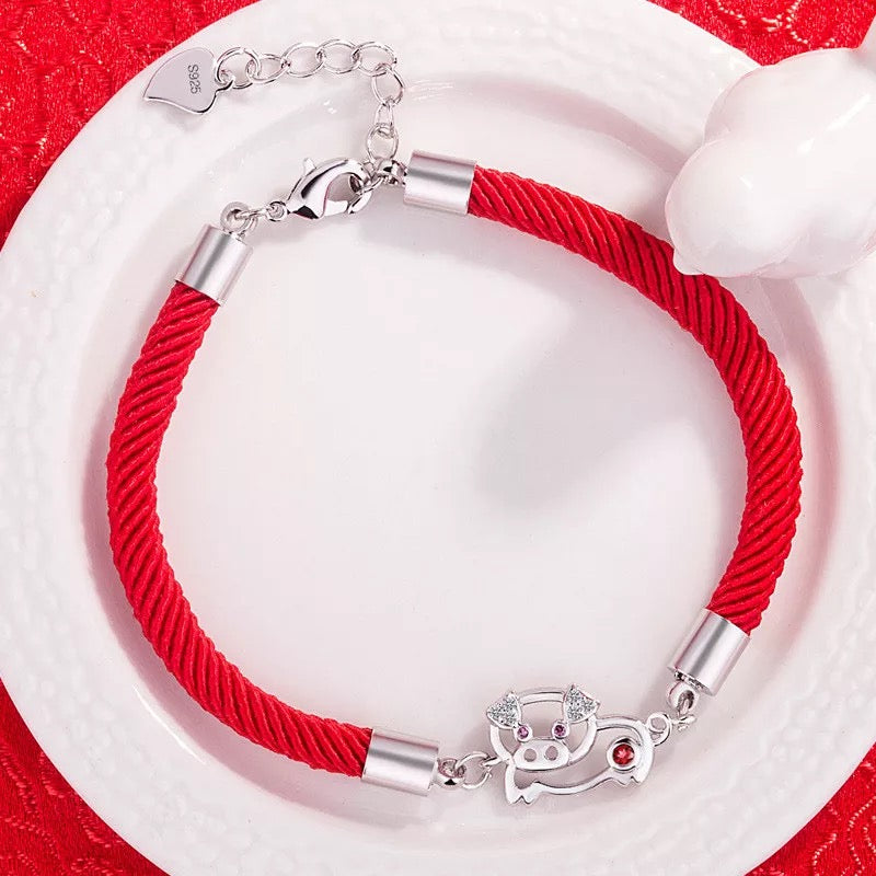 BRAZALETE CERDITO DE LA SUERTE TEJIDO