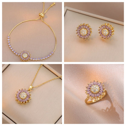 COMBO COLLAR ARETES BRAZALETE FLOR GIRASOL CRISTALES LILA INCRUSTADOS GIRATORIA ANTIESTRÉS MINIMALISTA