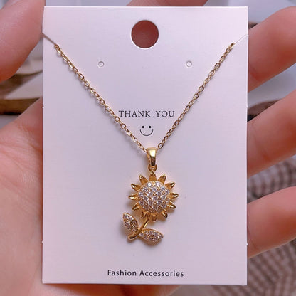 COLLAR FLOR GIRASOL CRISTALES INCRUSTADOS  GIRATORIO MINIMALISTA