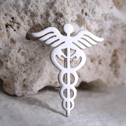 BROCHE  SÍMBOLO MÉDICO UNISEX