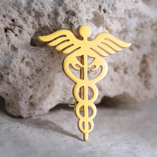 BROCHE  SÍMBOLO MÉDICO UNISEX